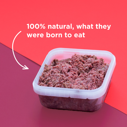 Container of ground meat with text '100% natural, what they were born to eat' on a red background