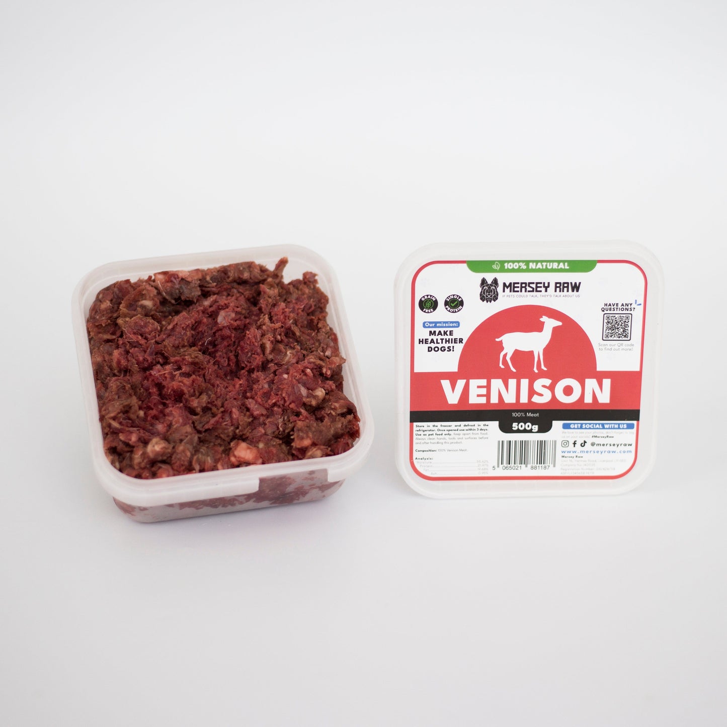 Container of venison pet food next to its packaging on a white background